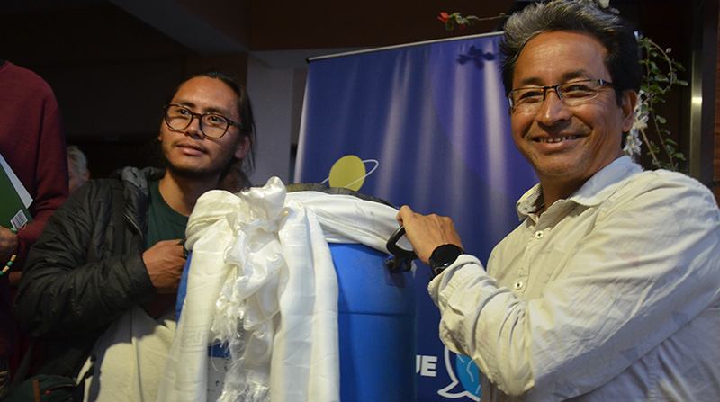 Climate activist Sonam Wangchuk holding a block of ice from Ladakh, to be presented to His Holiness the Dalai Lama. Photo: TPI/Yangchen Dolma