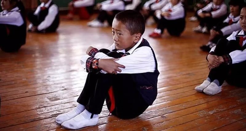 A boy waits in dance class in 2009 at a primary school in Lhasa, the capital of the Tibet Autonomous Region in China. (Greg Baker / Los Angeles Times)