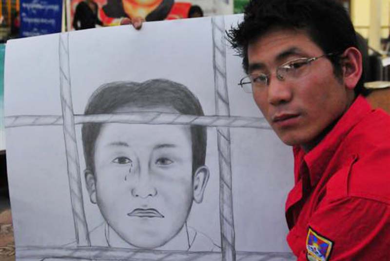 A Tibetan artist drawing jailed Panchen Lama on 26 April 2010 in Dharamshala, India. Photo: TWA