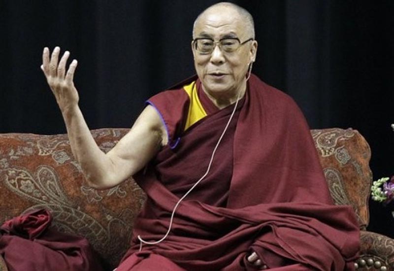His Holiness the  Dalai Lama gestures as he speaks to an audience in Indianapolis, Friday,  May 14, 2010. AP