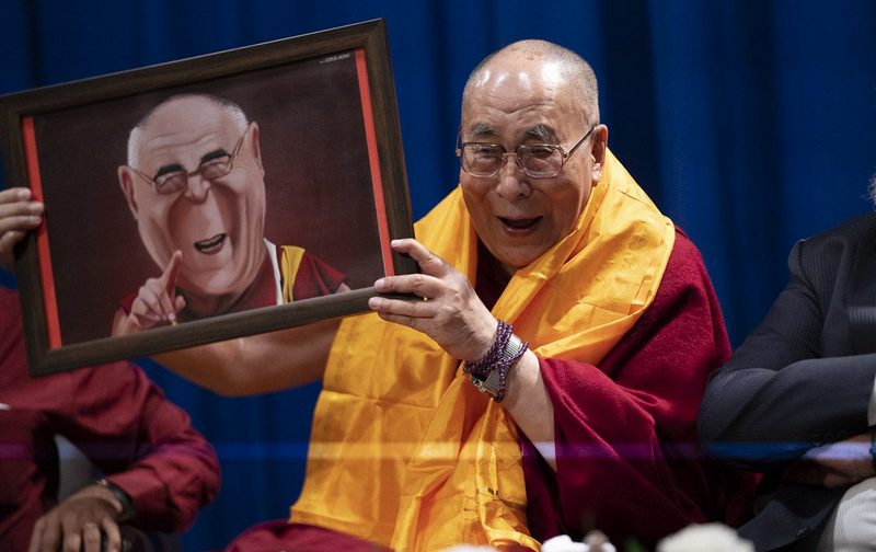 His Holiness holding a portrait presented to him by a student before his talk on compassion at Guru Nanak College of Arts, Science & Commerce in Mumbai, India on December 13, 2018. Photo: Lobsang Tsering