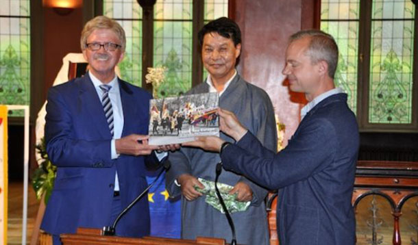 Representative Tashi Phuntsok with MEP Thomas Mann and Vincent Metten, EU Policy Director, ICT releasing the book. Photo: Brussels OOT