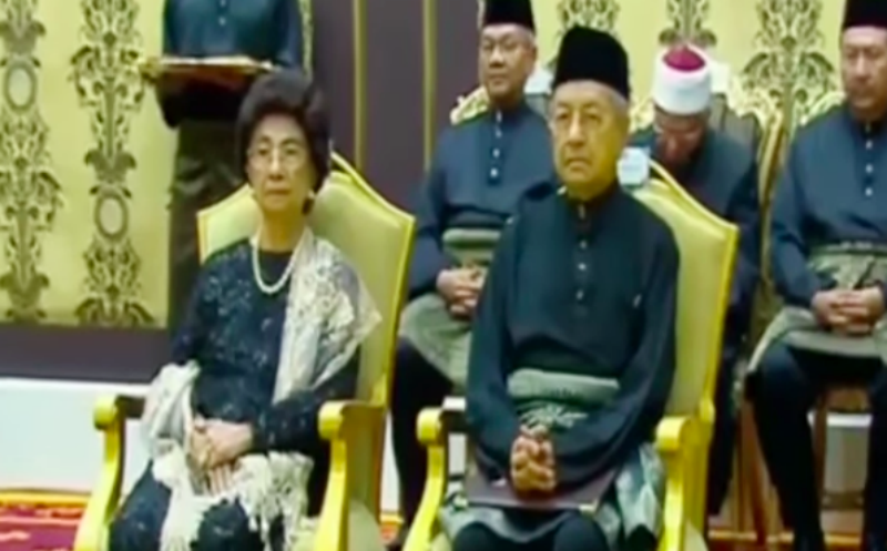 Dr Mahathir Mohamad and his wife Siti Hasmah Mohd during the swearing in ceremony. Photo: TNO