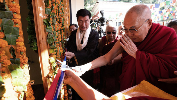 His Holiness the Dalai Lama cutting a ribbon to inaugurate the Tibetan Institute of Performing Arts' new auditorium in Dharamsala, India on October 29, 2019. Photo by Tenzin Choejor