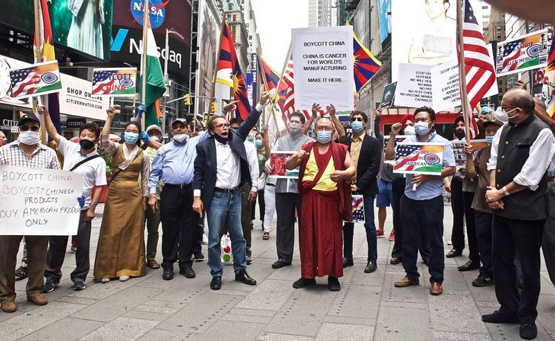 Protesters holding banners and posters in protest against the authoritarian communist regime in China, at Times Square, New York, USA, on July 03, 2020. Photo: TPI